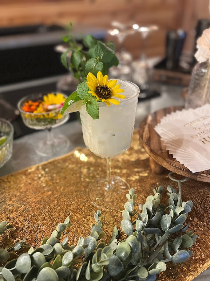 lime cocktail with flower garnish