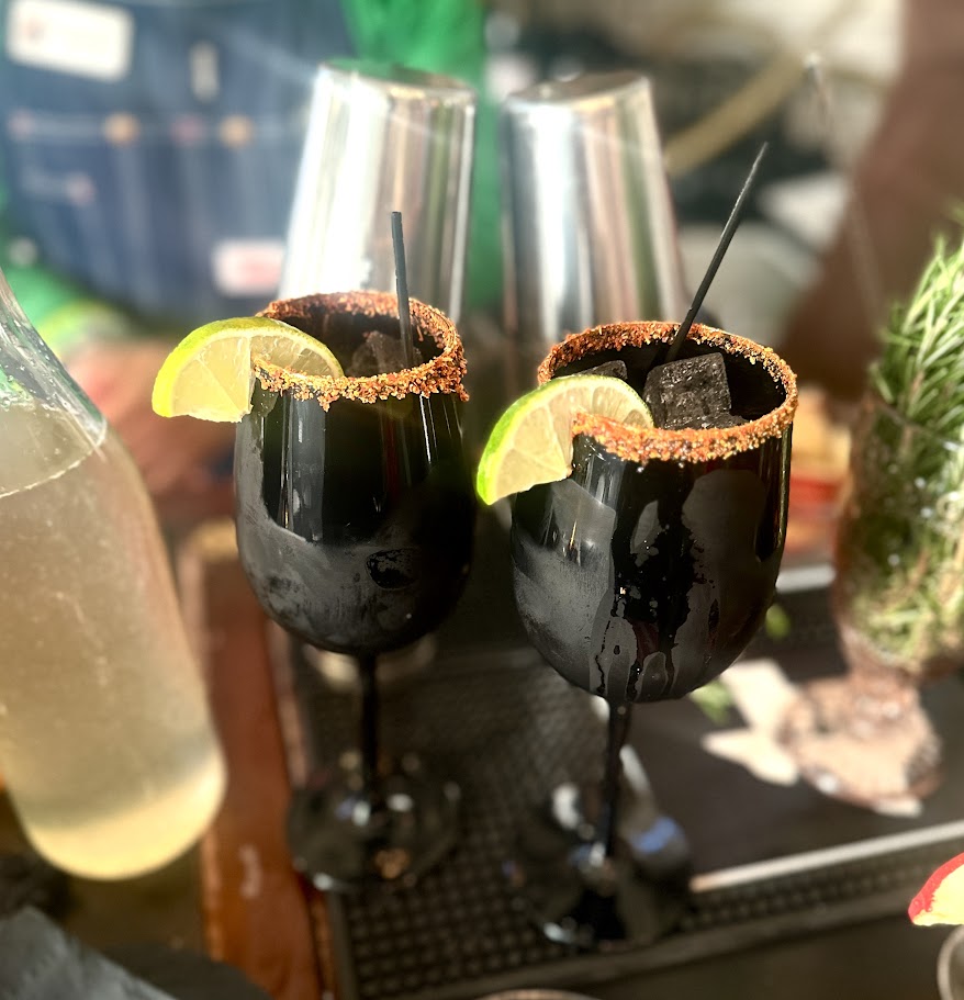 drinks in black wine glasses
